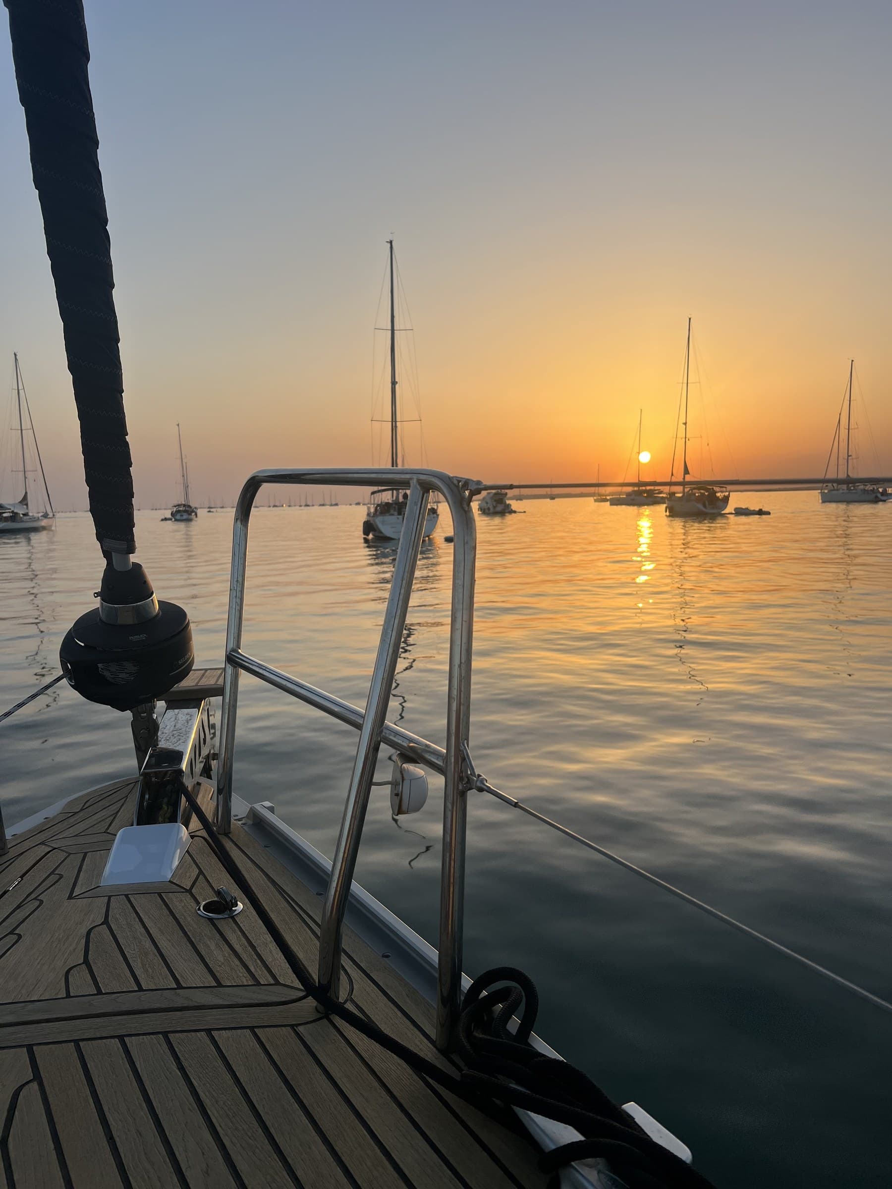 Quiet marina at sundown, sailboats on still water